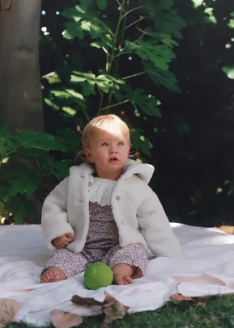 Manteau à capuche effet peau de mouton