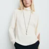 Blouse à col montant et manches asymétriques