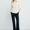 Blouse à col montant et manches asymétriques