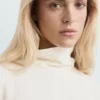 Blouse à col montant et manches asymétriques