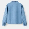 Blouse en denim brodée