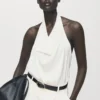 Blouse en satin avec encolure drapée