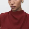Blouse à encolure drapée et ceinture