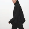 Blouse à manches évasées et volants