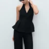 Gilet à dos nu et basque Gilet à dos nu et basque