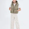 Gilet matelassé à capuche Gilet matelassé à capuche