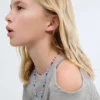 Haut en lurex avec découpes