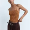 Haut en maille lurex avec dos croisé
