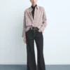 Jean à jambes larges avec boutons Jean à jambes larges avec boutons