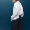 Jean à jambes larges avec boutons Jean à jambes larges avec boutons