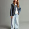 Jean à jambes larges avec ourlet retroussé Jean à jambes larges avec ourlet retroussé