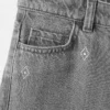 Jean à jambes larges et strass Jean à jambes larges et strass
