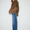 Jean à taille mi-haute et jambes larges avec ceinture croisée Jean à taille mi-haute et jambes larges avec ceinture croisée
