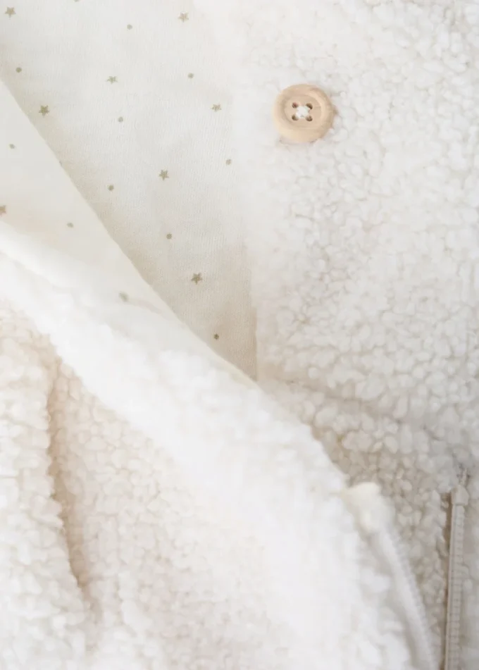 Long manteau en peau lainée