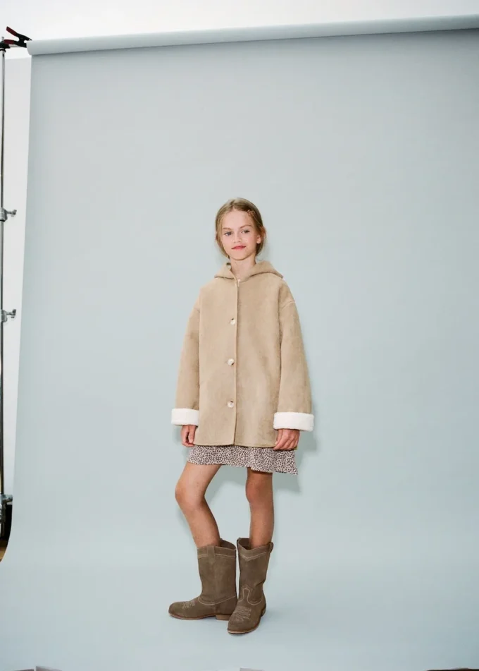 Manteau à capuche effet peau de mouton