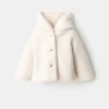Manteau à capuche effet peau de mouton
