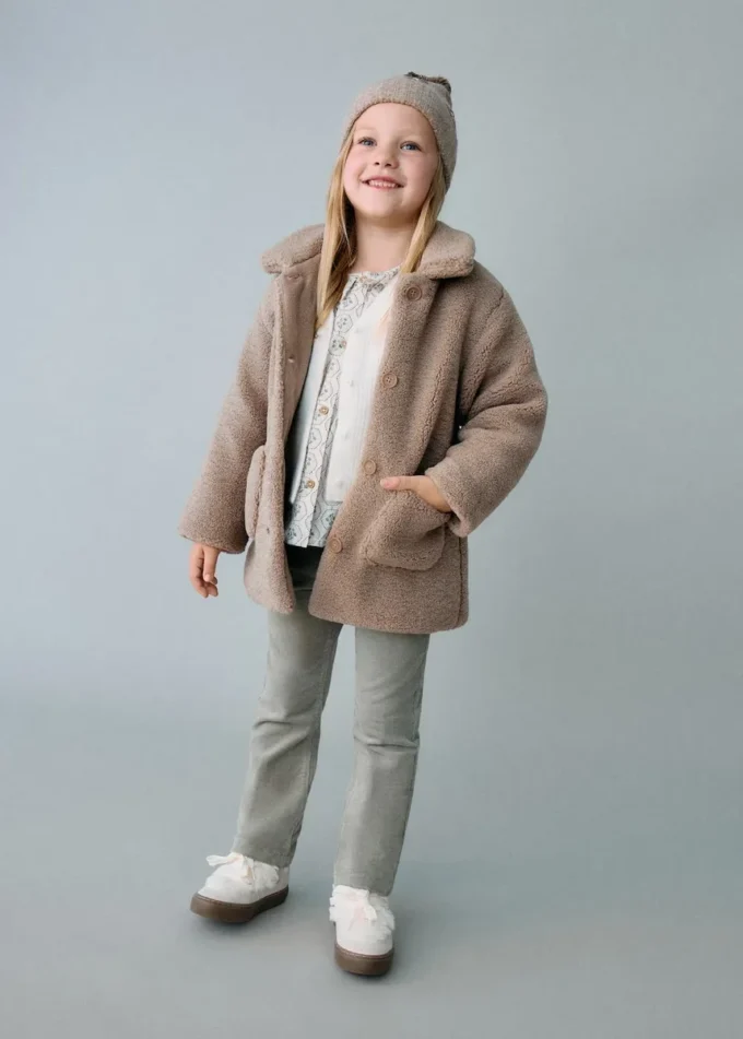 Manteau effet peau lainée