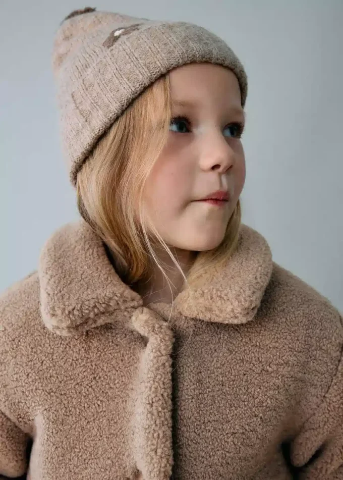 Manteau effet peau lainée