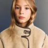 Manteau en fausse fourrure avec boutons