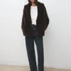 Manteau en fausse fourrure avec revers