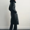 Manteau en simili cuir avec col en fourrure