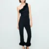 Pantalon capri en maille fine à plumes Pantalon capri en maille fine à plumes