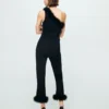 Pantalon capri en maille fine à plumes Pantalon capri en maille fine à plumes