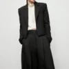 Pantalon de costume à jambes larges et plis