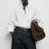 Pantalon en denim à jambes larges et plissé Pantalon en denim à jambes larges et plissé