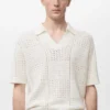 Polo en coton tricoté avec motif en dentelle Polo en coton tricoté avec motif en dentelle