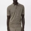 Polo en coton tricoté avec motif en dentelle Polo en coton tricoté avec motif en dentelle