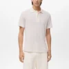 Polo en coton tricoté avec motif en dentelle Polo en coton tricoté avec motif en dentelle