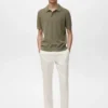 Polo en coton tricoté avec motif en dentelle Polo en coton tricoté avec motif en dentelle