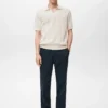 Polo en coton tricoté avec motif en dentelle Polo en coton tricoté avec motif en dentelle