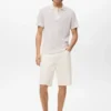 Polo en coton tricoté avec motif en dentelle Polo en coton tricoté avec motif en dentelle