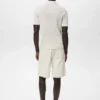 Polo en coton tricoté avec motif en dentelle Polo en coton tricoté avec motif en dentelle
