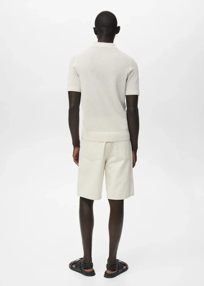 Polo en coton tricoté avec motif en dentelle Polo en coton tricoté avec motif en dentelle