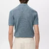 Polo en coton tricoté avec motif en dentelle