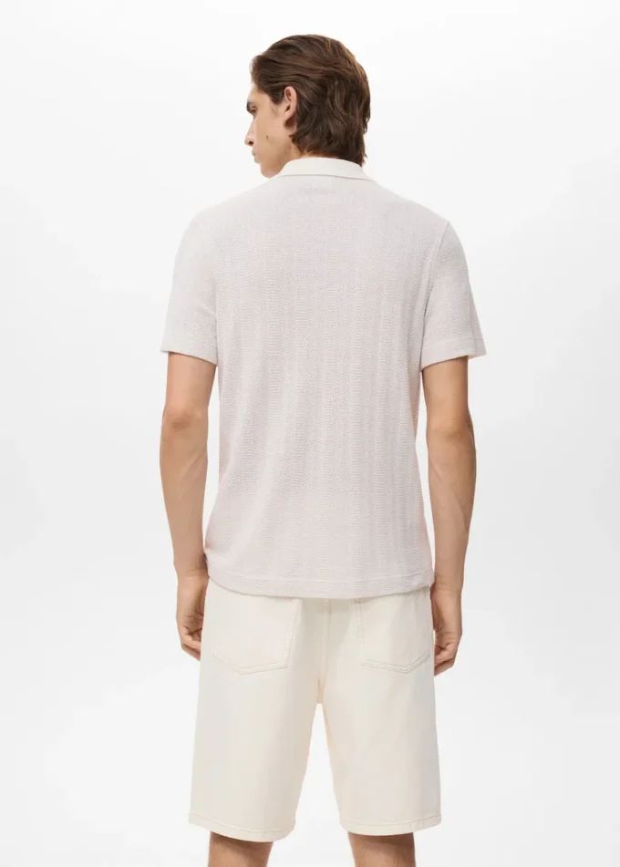 Polo en coton tricoté avec motif en dentelle Polo en coton tricoté avec motif en dentelle