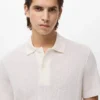 Polo en coton tricoté avec motif en dentelle Polo en coton tricoté avec motif en dentelle