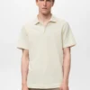 Polo en maille fine côtelée
