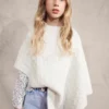 Poncho en maille torsadée