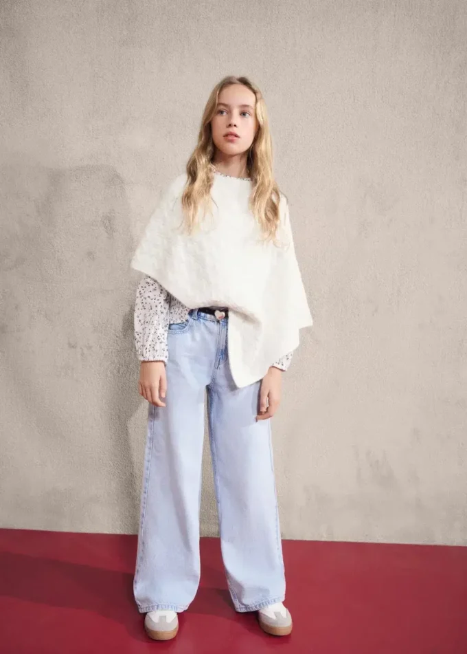 Poncho en maille torsadée