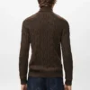 Pull à col roulé en maille torsadée