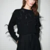 Pull en maille avec plumes