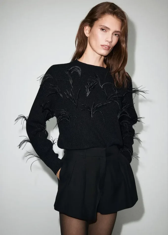 Pull en maille avec plumes