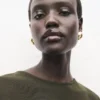 Robe en maille fine avec fronces sur les côtés Robe en maille fine avec fronces sur les côtés