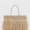 Sac cabas en fibres naturelles avec pompons Sac cabas en fibres naturelles avec pompons