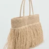 Sac cabas en fibres naturelles avec pompons Sac cabas en fibres naturelles avec pompons