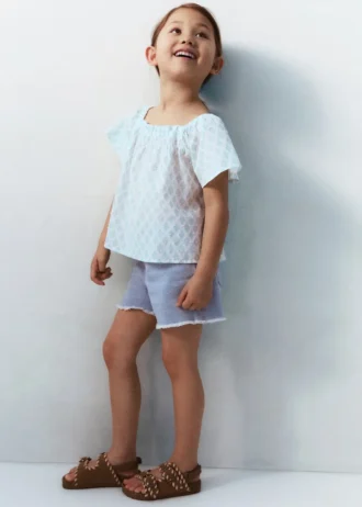 Short en denim à ourlet effiloché